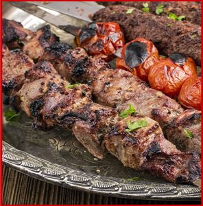 A plate of food with meat and vegetables on it.