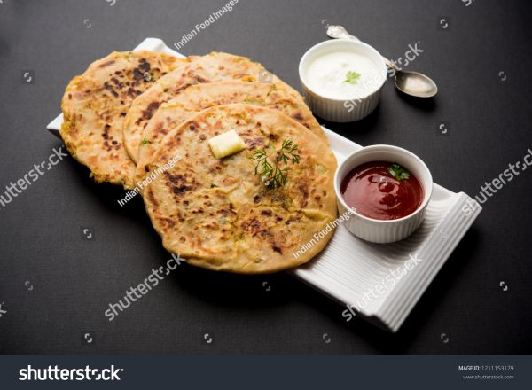 A plate of food with some sauce and other items