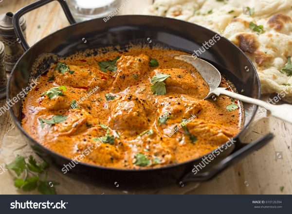 A pan of food with some meat and sauce