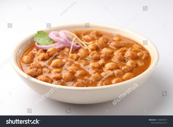 A bowl of food with some type of sauce.