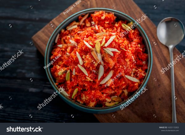 A bowl of food on top of a wooden board.