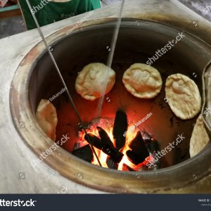 A pot of food cooking on the fire.