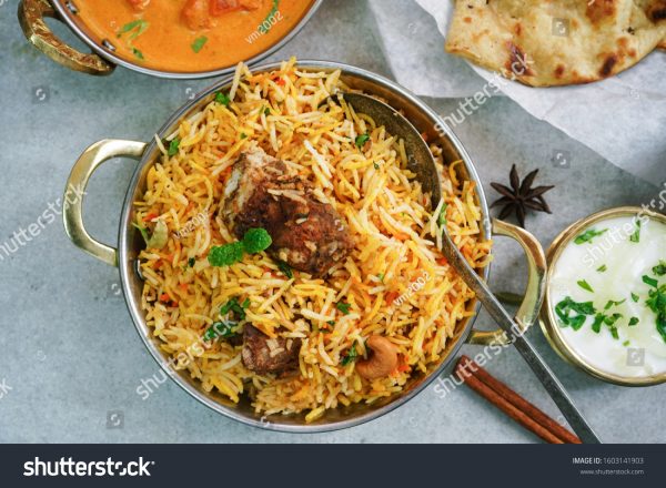 A bowl of rice and meat on the table