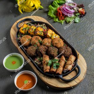 A tray of food with meat and vegetables on it