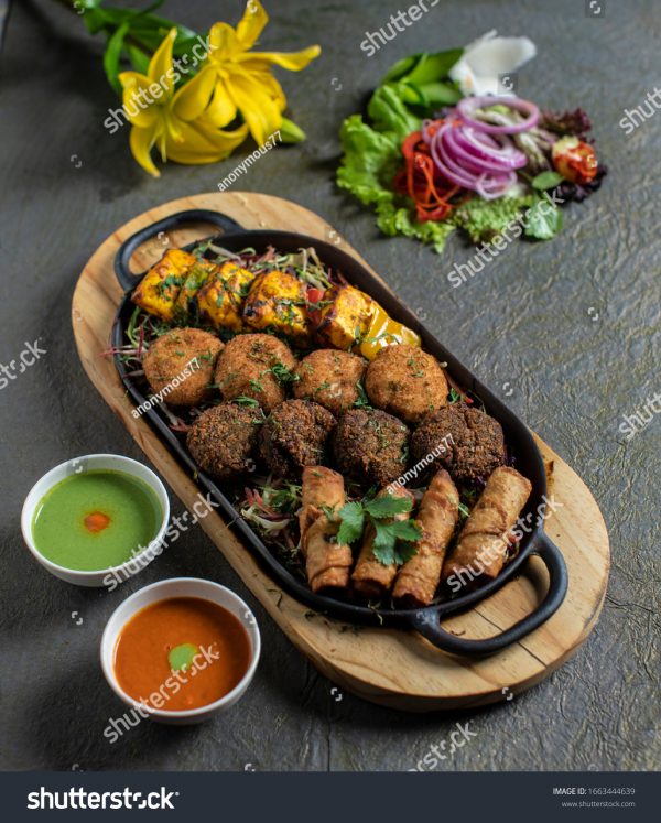 A tray of food with meat and vegetables on it