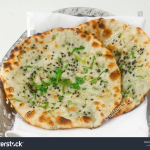 A close up of two flatbread pizzas on a plate