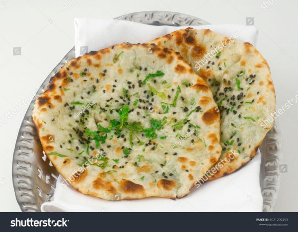 A close up of two flatbread pizzas on a plate