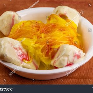 A bowl of food with some kind of yellow stuff