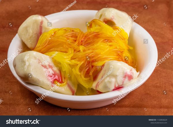 A bowl of food with some kind of yellow stuff