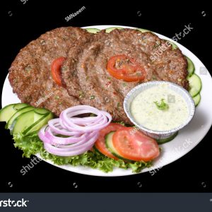 A plate of food with meat, vegetables and sauce.