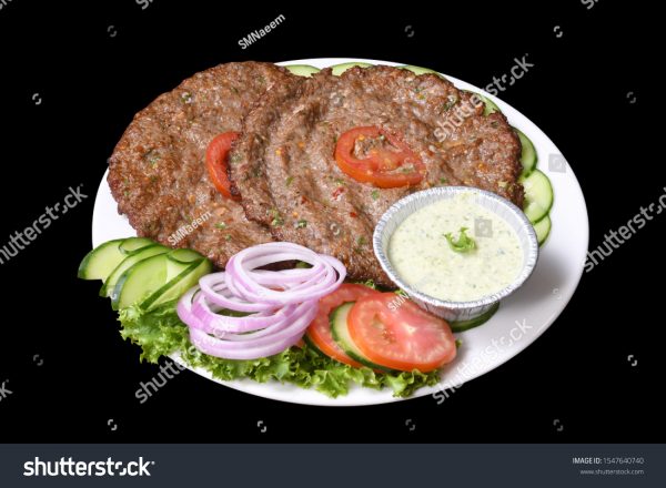 A plate of food with meat, vegetables and sauce.