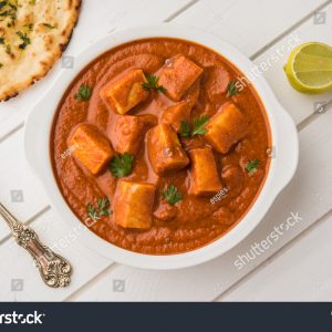 A bowl of food on top of a table.