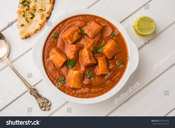 A bowl of food on top of a table.