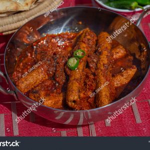 A bowl of food on top of a table.