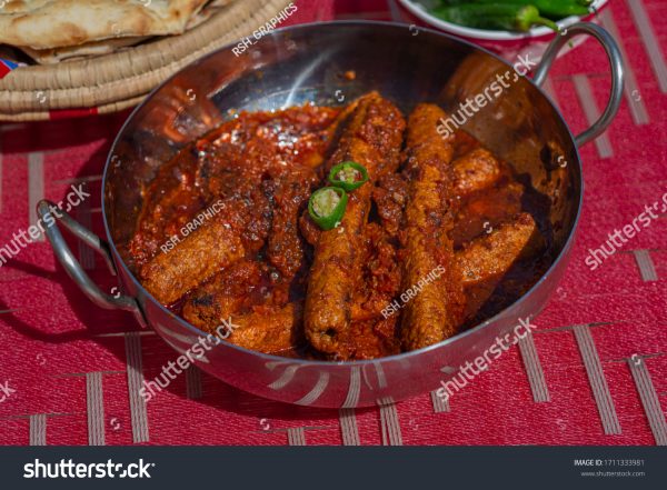 A bowl of food on top of a table.